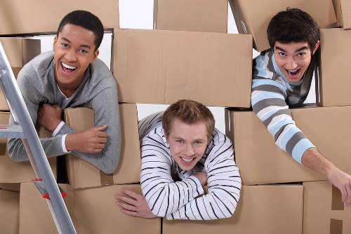 Packed moving boxes ready for flat removals in Tooting