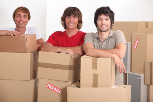 Professional movers transporting office furniture in Tooting
