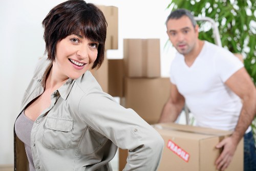 Carefully packed household items inside moving boxes