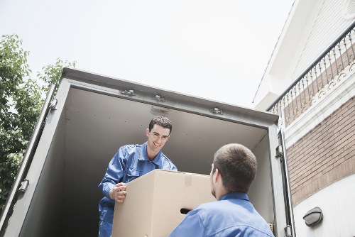 Professional movers packing household items for relocation