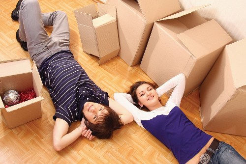 Professional moving team preparing furniture for a Tooting flat removal