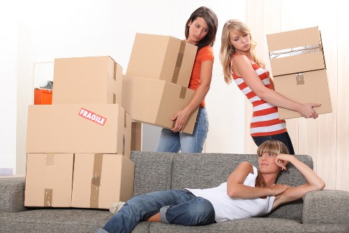 Local movers handling boxes and furniture near Tooting homes
