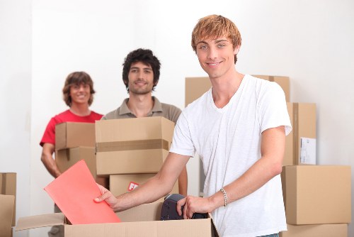 Furniture and boxes being organised into a moving truck in Tooting