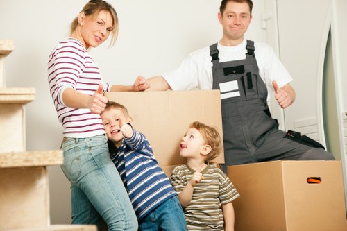 Crew using safe lifting techniques during a move